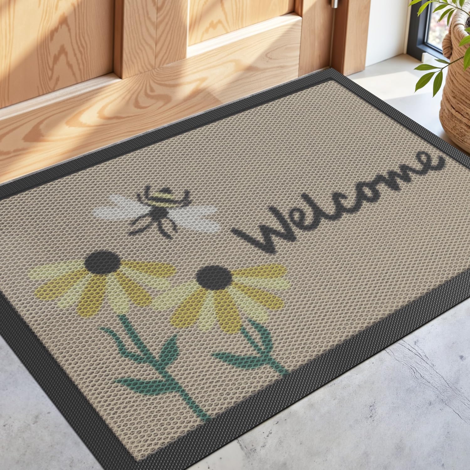 DEXI front door mat with bee and flower design welcoming guests while trapping dirt and moisture.
