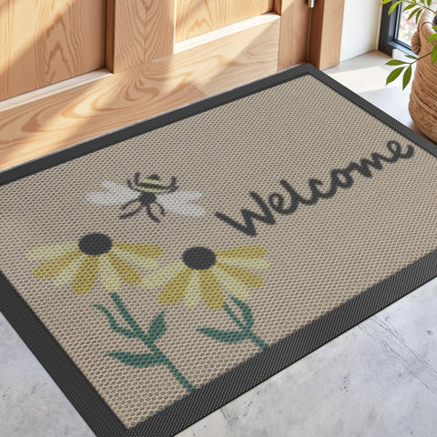 DEXI front door mat with bee and flower design welcoming guests while trapping dirt and moisture.