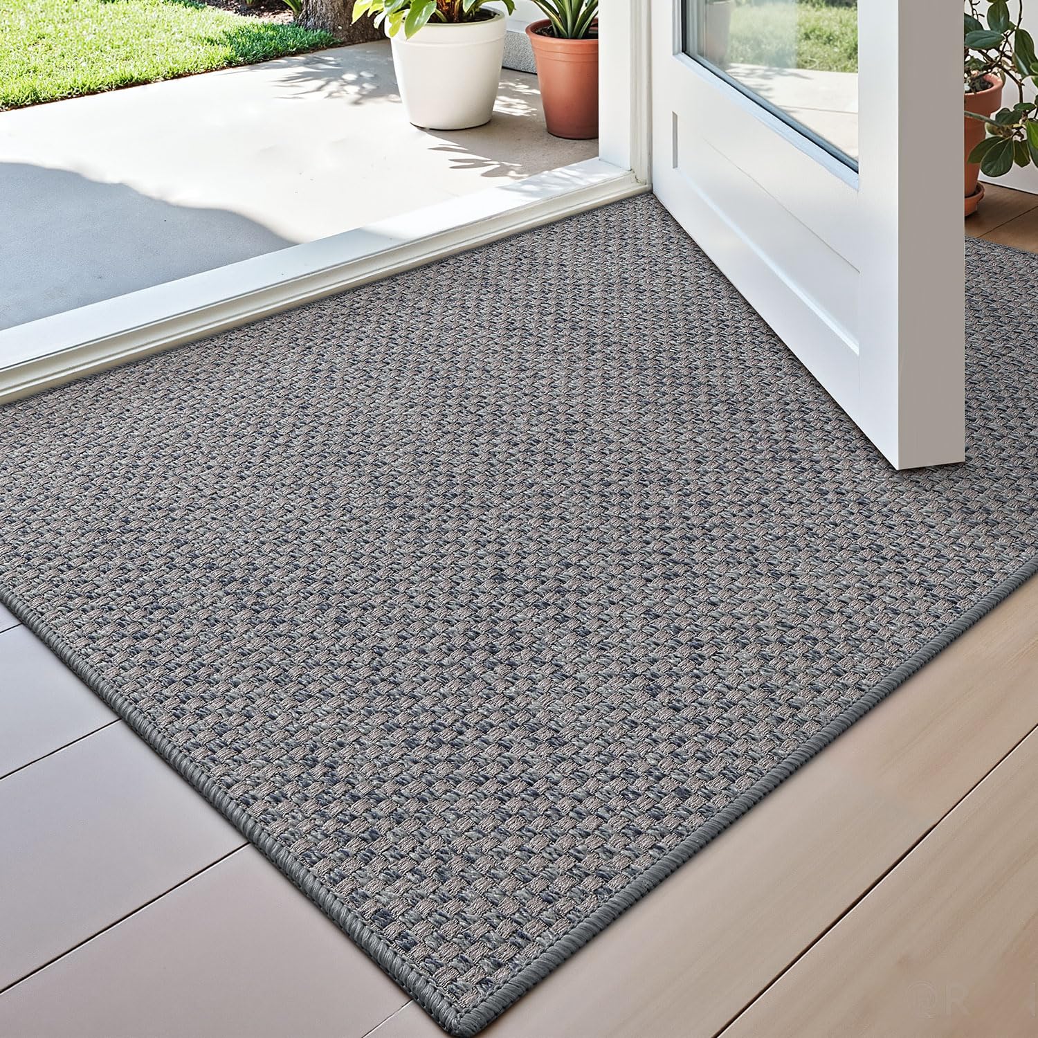 DEXI Ultra Thin Door Mat at the entryway traps dirt and moisture.