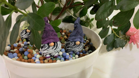 Dianreno gnomes for bookshelves add cheerful detail.
