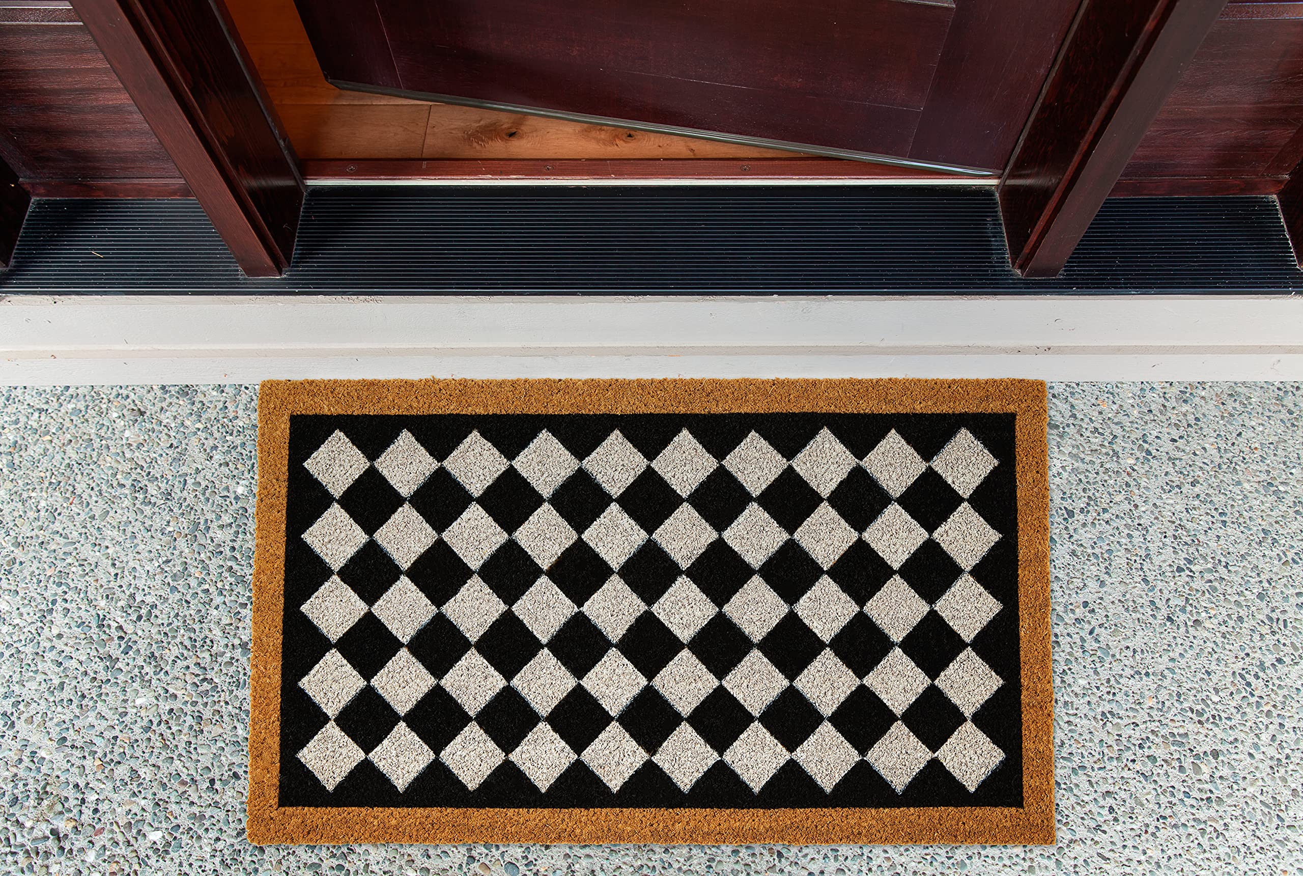 DII Harlequin-pattern coir mat on a front porch for daily dirt wiping.