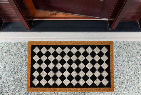 DII Harlequin-pattern coir mat on a front porch for daily dirt wiping.
