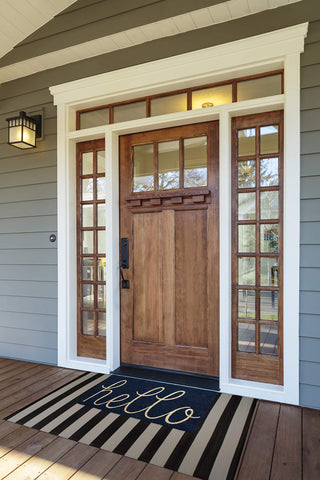 DII Hello Coir Fiber Doormat in navy color welcomes guests.