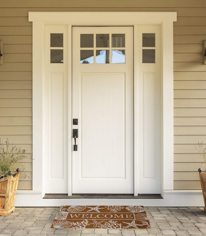 DII Seashells coir doormat on entryway with non-slip backing for safety