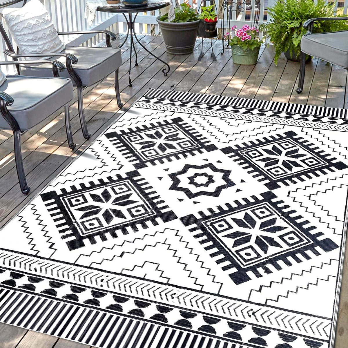 DiiKoo waterproof outdoor rug 5x8ft with reversible pattern for patios and RV adventures.