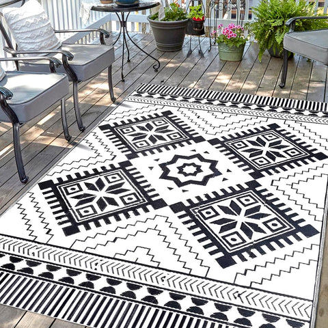DiiKoo waterproof outdoor rug 5x8ft with reversible pattern for patios and RV adventures.
