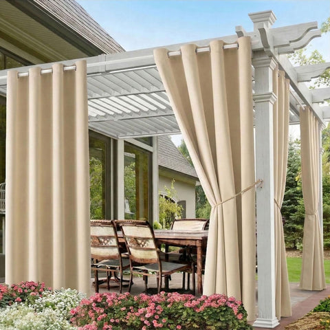 DIVA EN CAMINO DEC waterproof outdoor curtain in beige blocks sunlight on a patio.