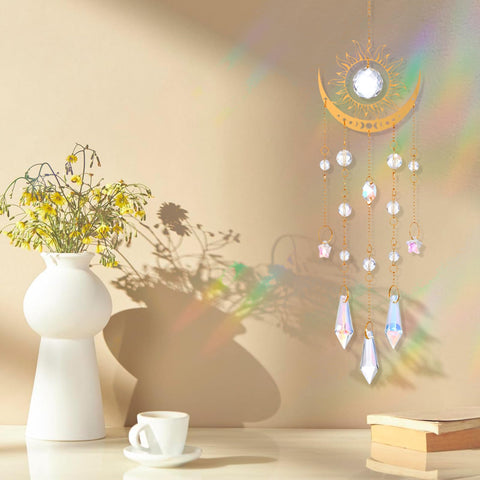 Divina Vitae crystal suncatcher near sunlit garden, dispersing light into prisms.