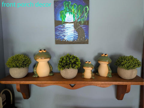 DIY Hub hand-painted ceramic frogs pair with solar lights.