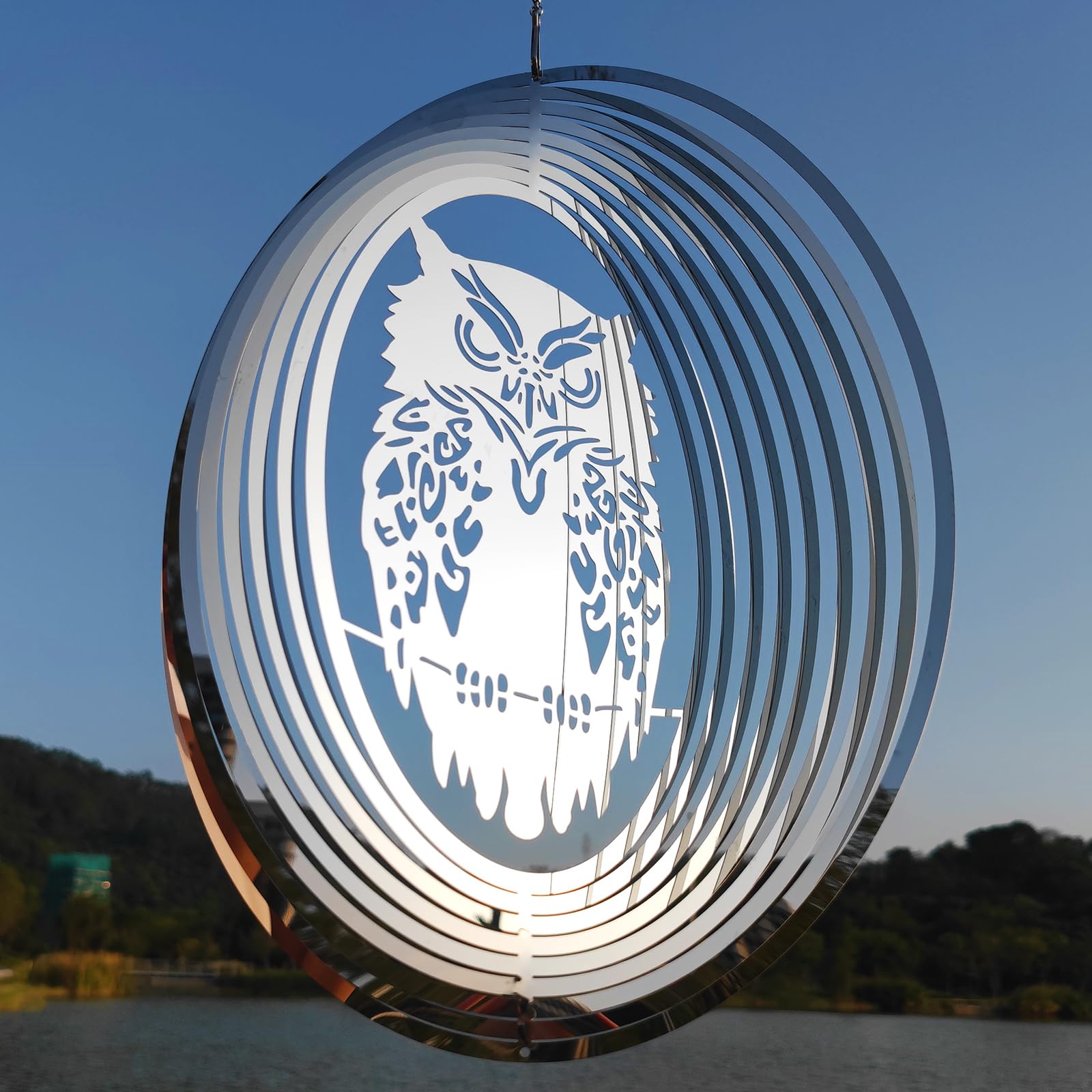 DJUAN Owl Scarecrow bird deterrent with a 16-inch mirror disc keeps woodpeckers away from patios.