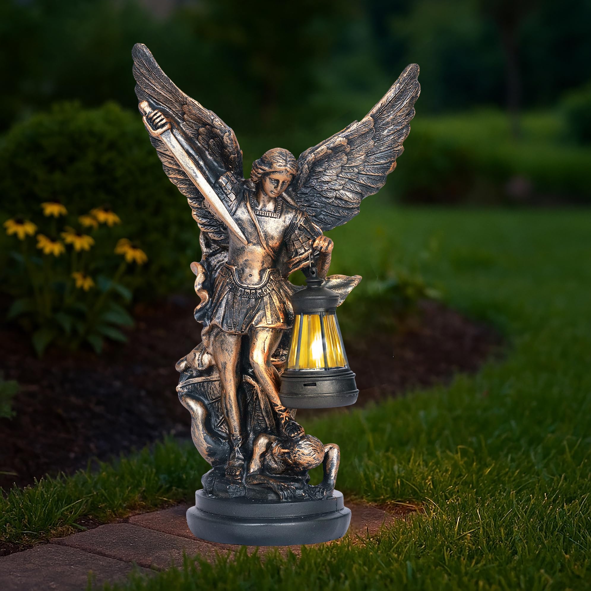 Dlfghos St Michael Archangel solar statue glows softly on a sunlit patio