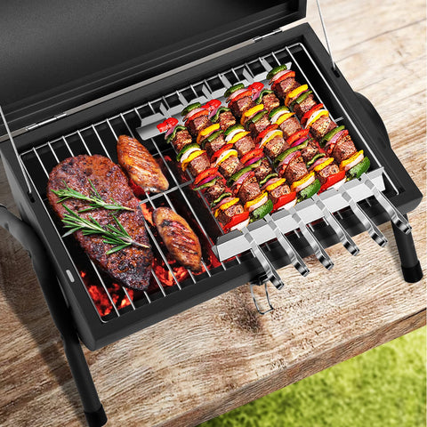 DNKMOR grill with wooden handles for safe, comfortable carrying.