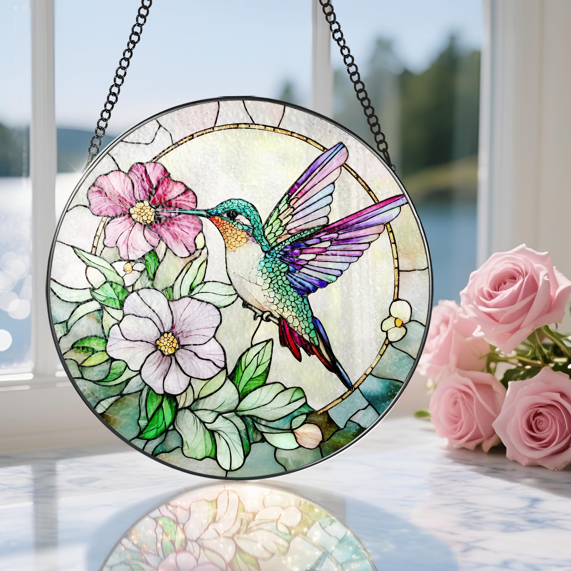 DOUHASU hummingbird suncatcher packaged securely with plastic hook and protective packaging.