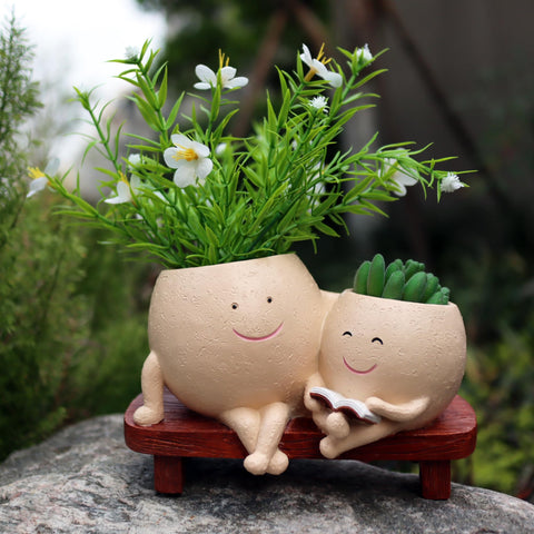 Dolkgy planter on a sunny windowsill ready for real or artificial plants.
