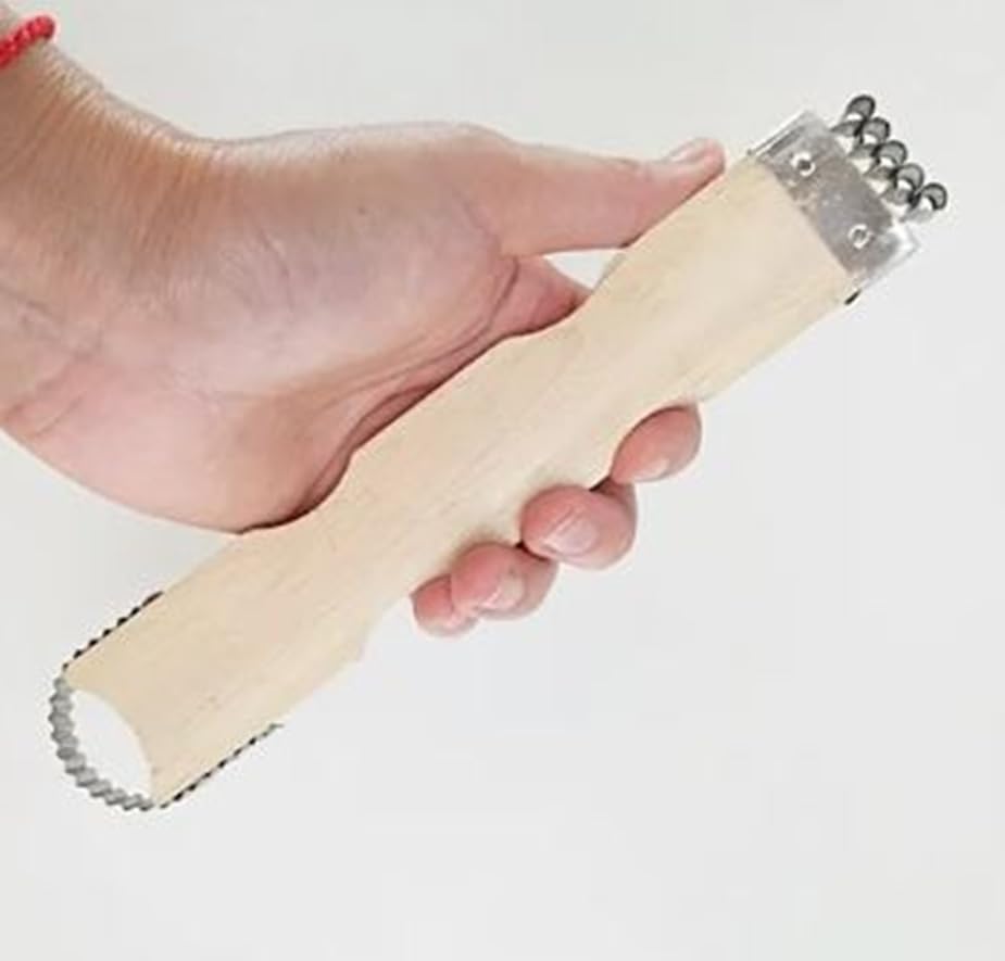 Dolphin Shop coconut grater in use for quick shredded coconut