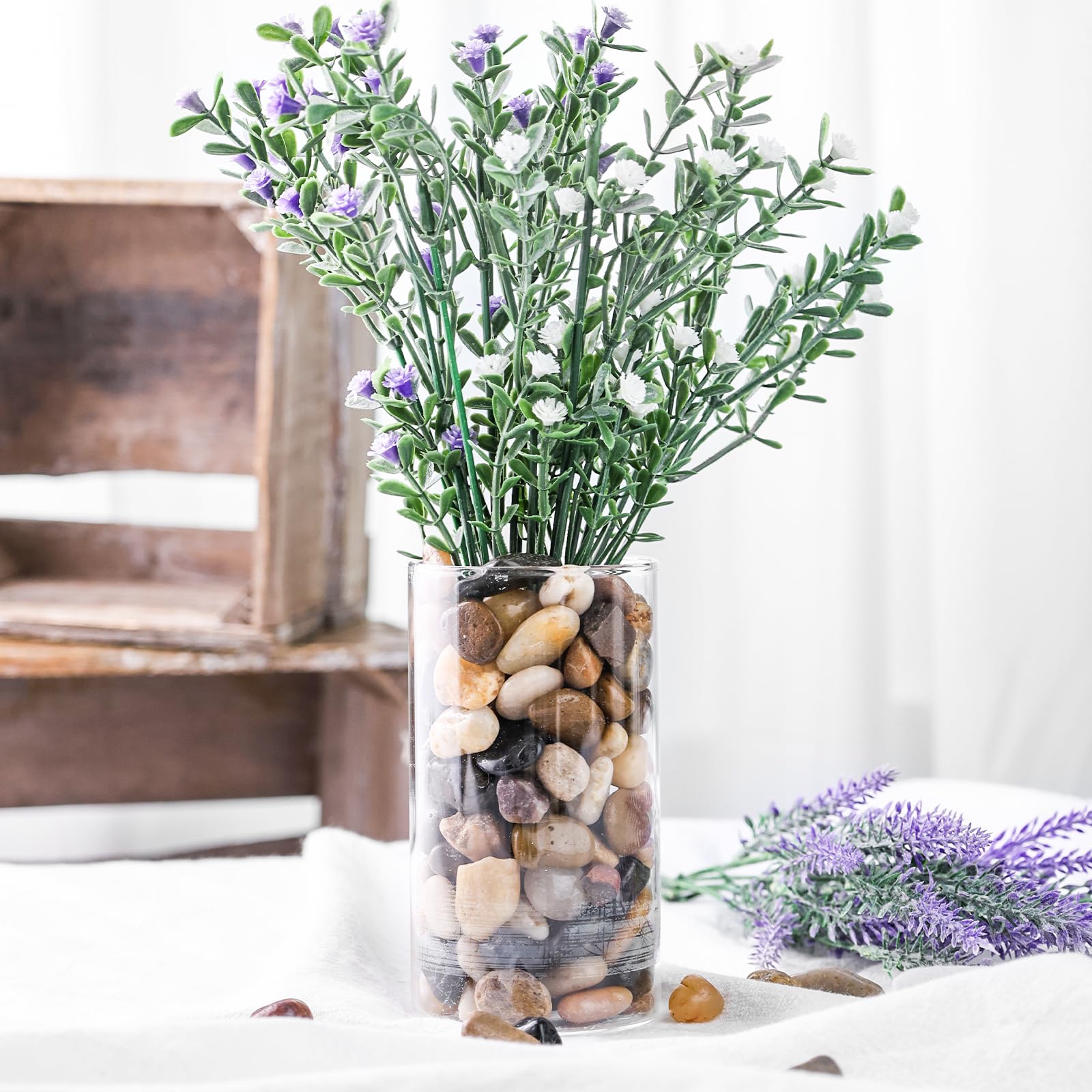 Pebbles for plants topping soil in a container garden for a fresh look