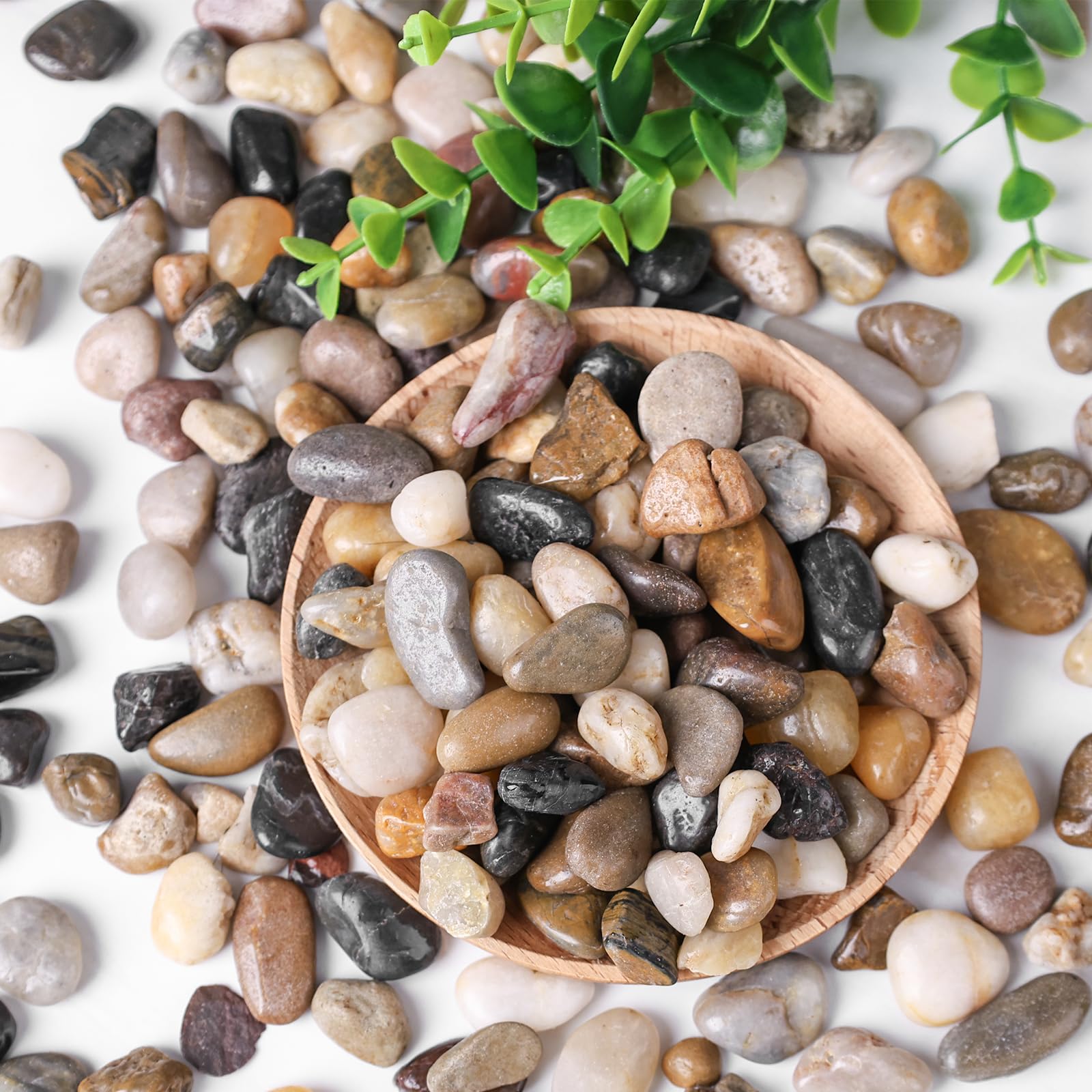 Round smooth pebbles in a garden bed providing drainage and style
