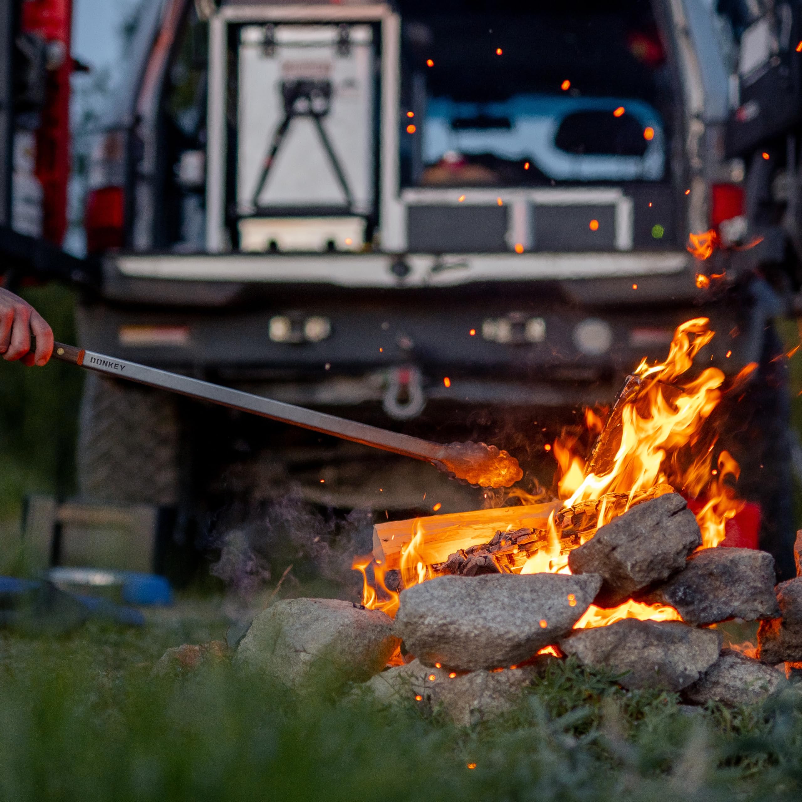 Donkey Long Tong beside a bonfire highlighting multi-use capability.