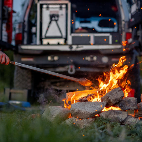 Donkey Long Tong beside a bonfire highlighting multi-use capability.