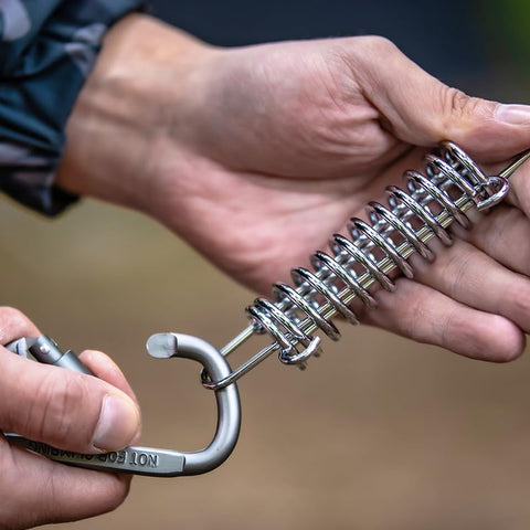Doucdoft slings spring adapts to movement for safer gear mounting.