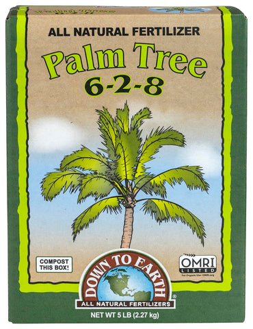 Down To Earth palm tree fertilizer bottle being applied for lush fronds