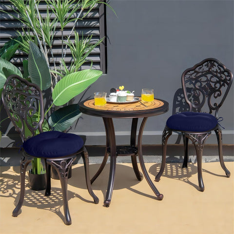 Downluxe Bistro navy cushion on seating demonstrates easy-care fabric in sunlight.