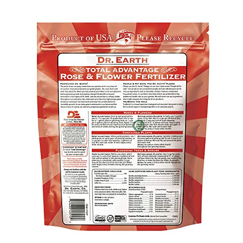Dr. Earth Total Advantage for flowering plants in garden ready to boost blooms and soil health.