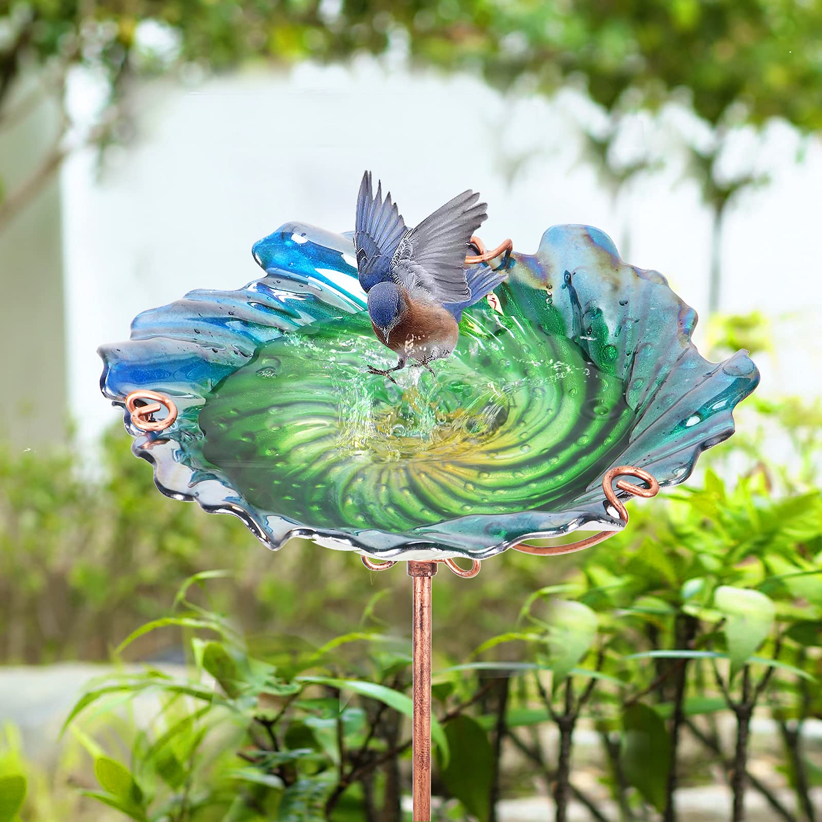 DREAM GARDEN outdoor glass bird bath placed in a garden setting