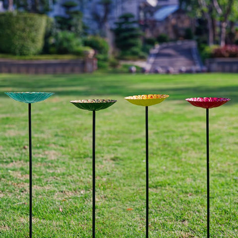 DREAMSOUL 4-piece bird bath set ready to place around your garden.