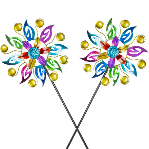 Dreamysoul wind spinner with colorful blades embellishing a sunny garden.