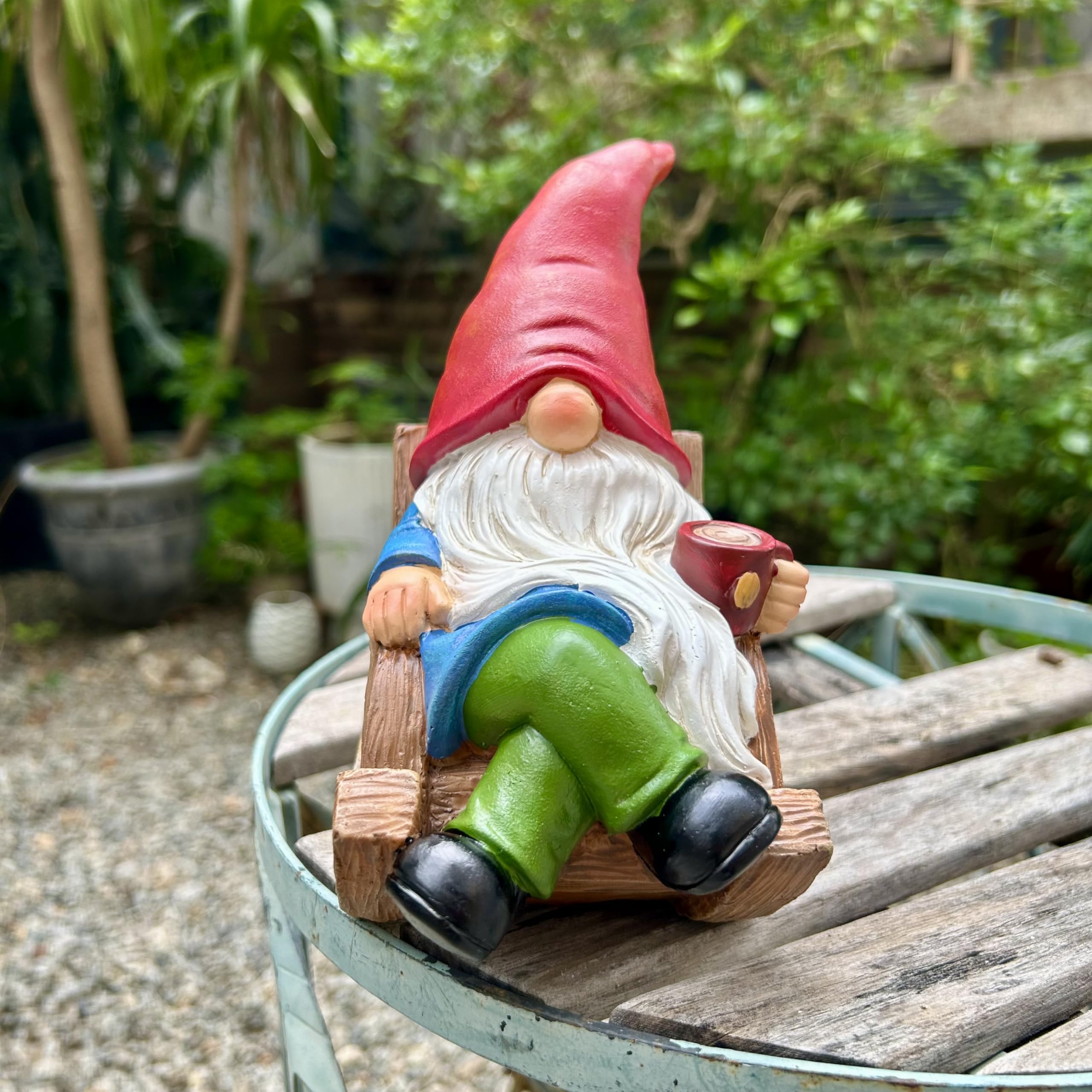 Drinking Coffee Gnome statue on lawn enhances seasonal decor.