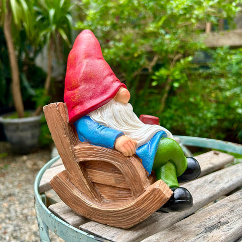 Drinking Coffee Gnome statue in yard creates a garden focal point.