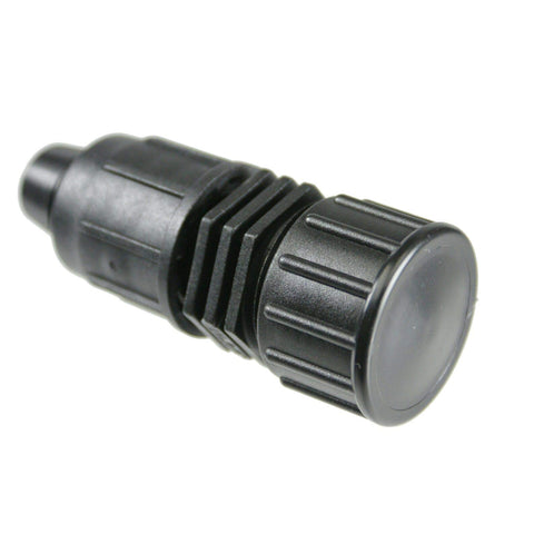Drip Depot Perma-Loc end cap on 1/2-inch tubing closes irrigation runs securely.