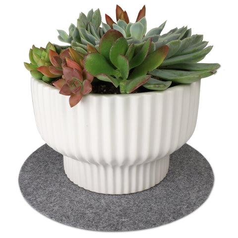 Drymate plant coaster outdoors on patio protects surfaces.