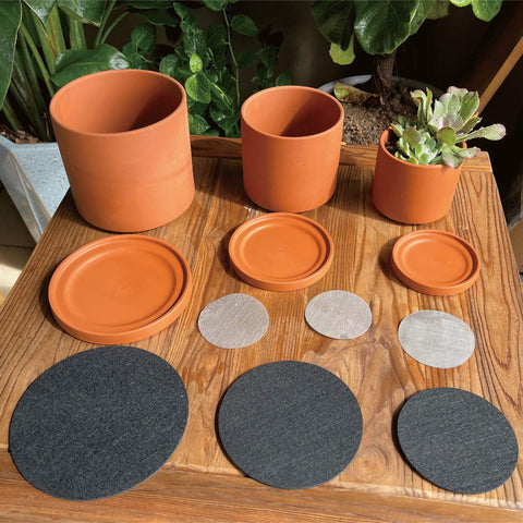 D'vine Dev terracotta pot with detachable saucer for clean surfaces.