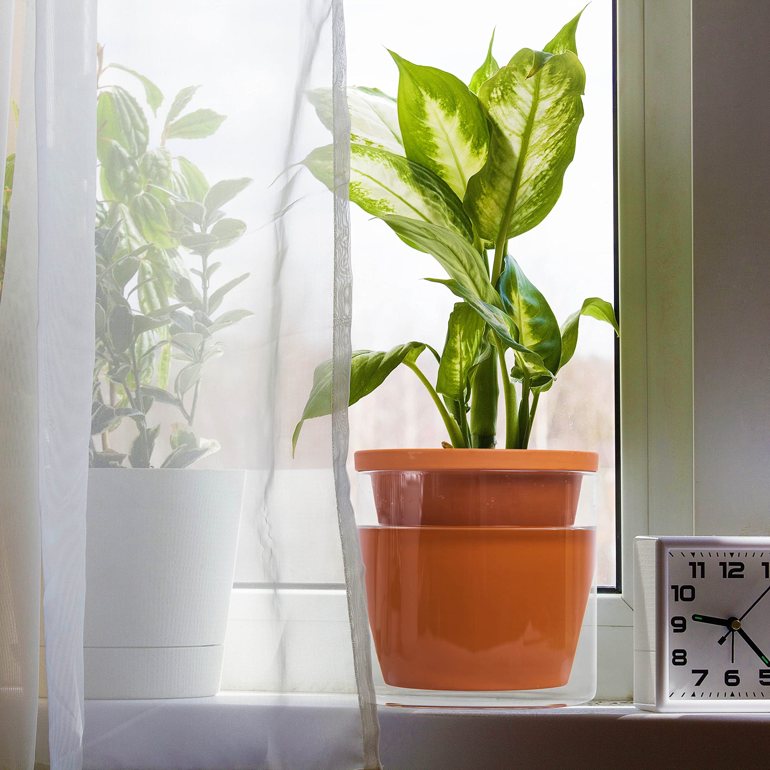 Compact footprint fits tabletops and shelves with chic decor appeal.