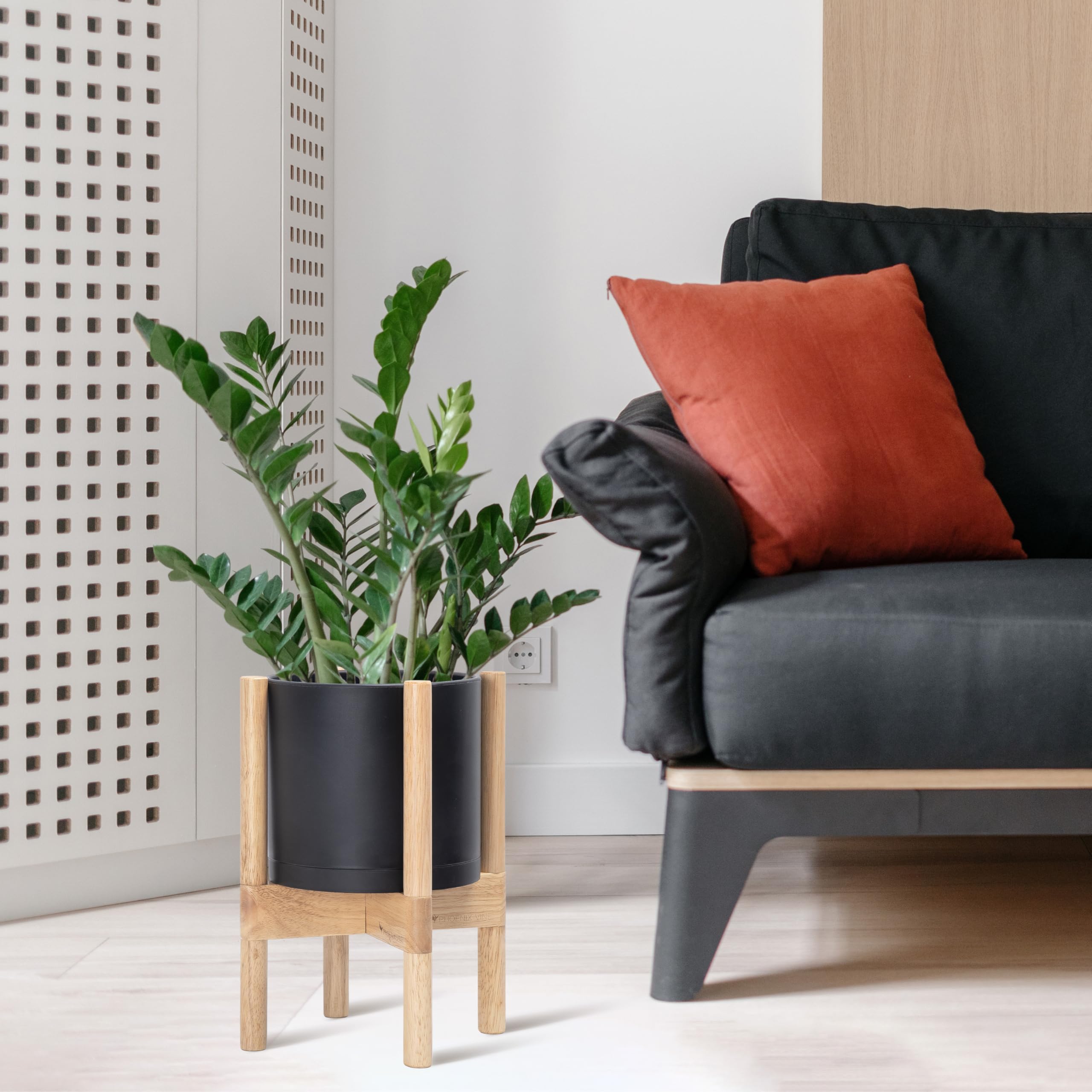 D'vine Dev natural wood stand complements the matte pot for a warm display.