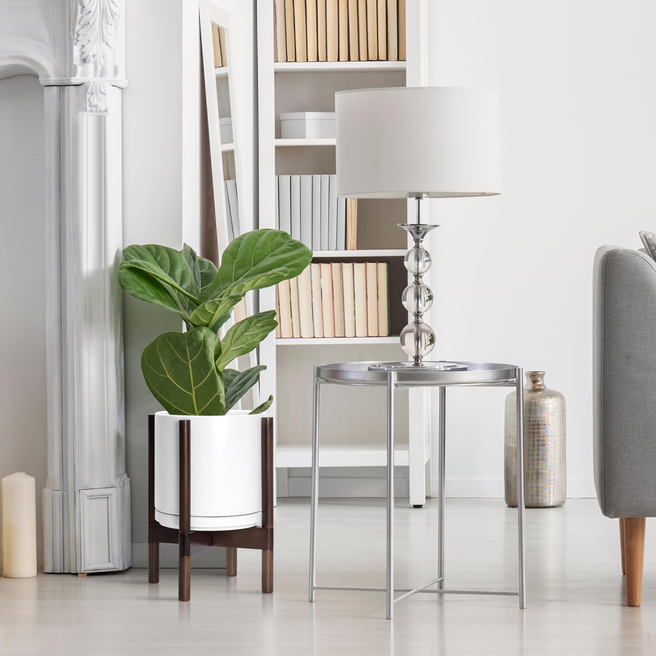 D'vine Dev round white planter on walnut wood stand complements modern interiors.