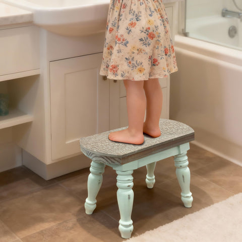 Dwellington solid wood step stool offers sturdy reach for high shelves.