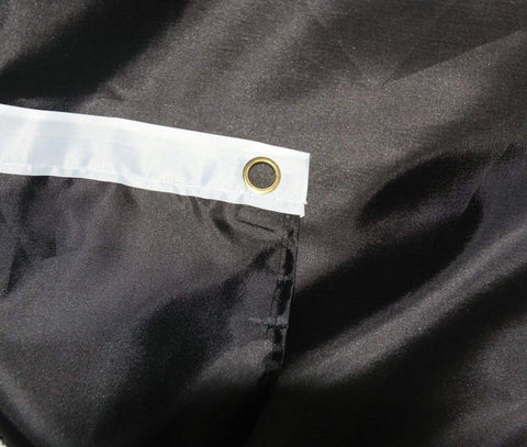 Dyung Tec pirate flag fluttering in a light breeze for outdoor use.
