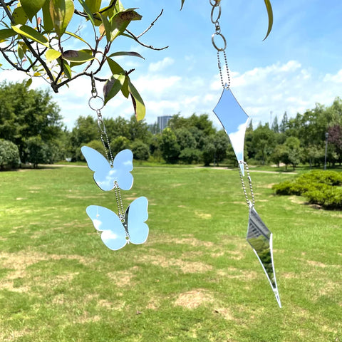 EACILLES fruit-tree protection with reflective discs reducing bird visits.