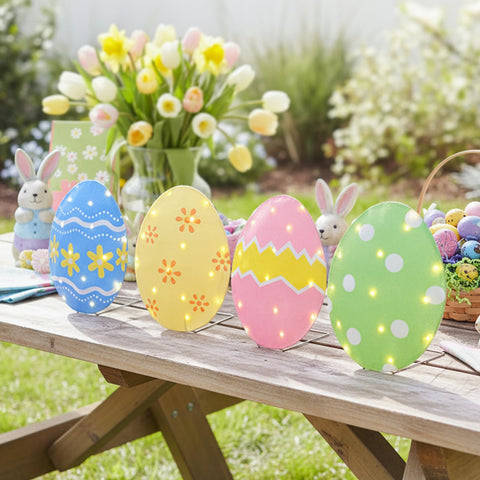 EAMBRITE Easter egg lights hanging from railing add whimsical charm to a porch
