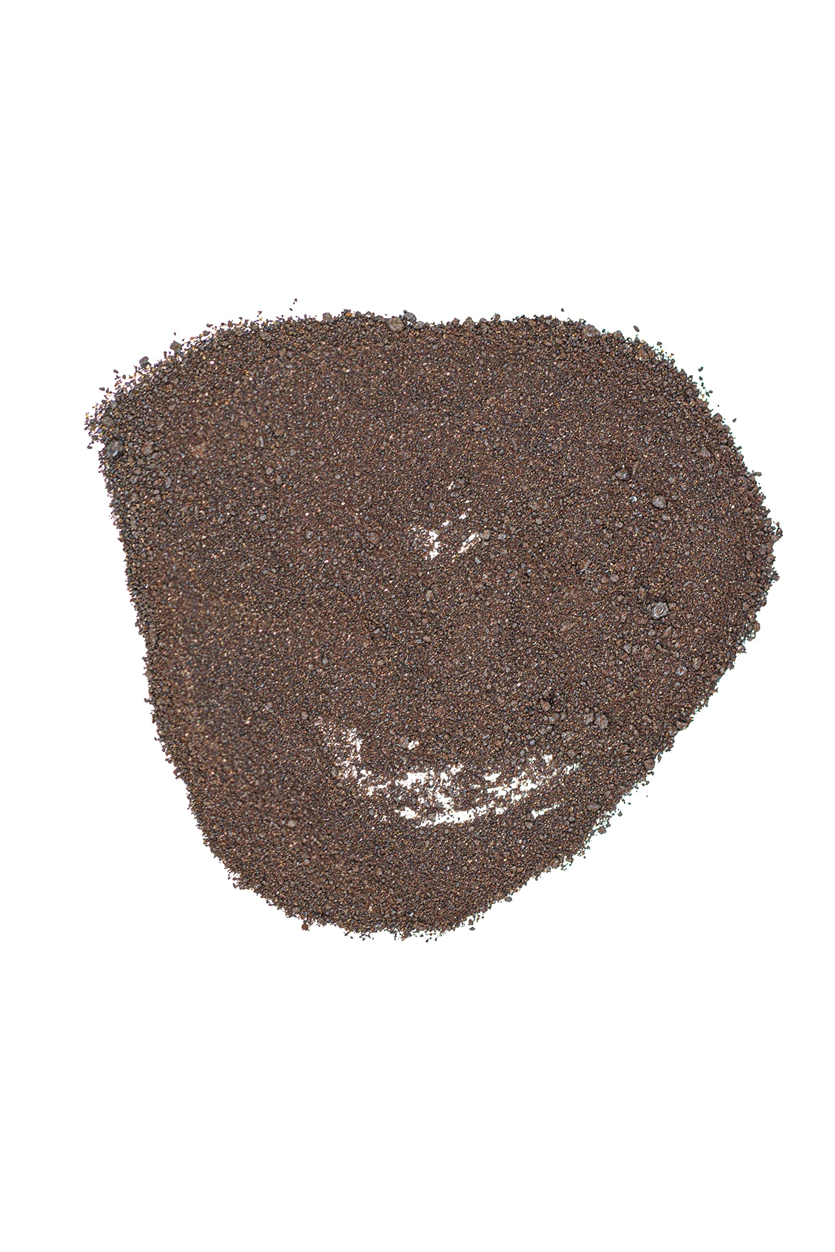 Earth Science Blood Meal in a lush garden bed supporting shrubs and vegetables.