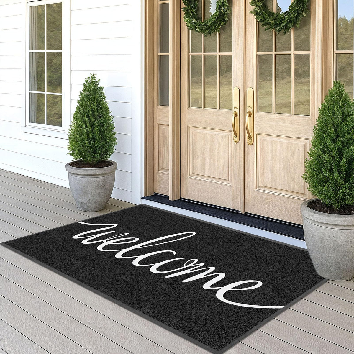 Earthall welcome mat at the front door traps dirt and withstands outdoor use