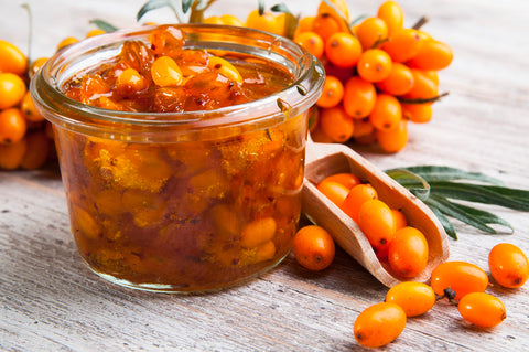 Earthcare Seeds Sea Buckthorn orange berries closeup, vibrant color and fruity aroma.