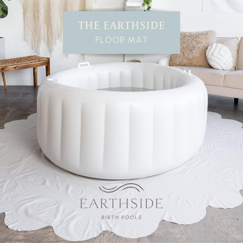 Earthside floor covering marshmallow draped over pool for heat retention during labor.