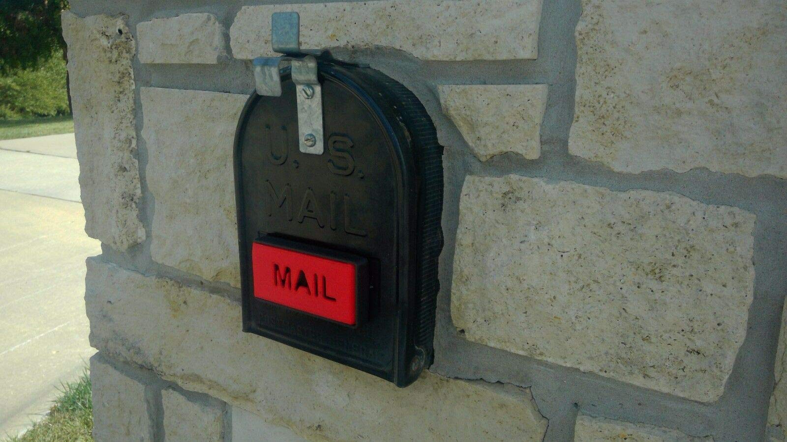 Earthtec mailbox flag with front-mount on brick or stone for improved visibility