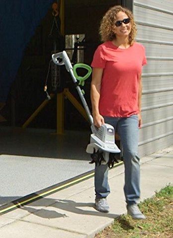 Earthwise TC70025 tiller, side view, showcases lightweight maneuverability for yard work.