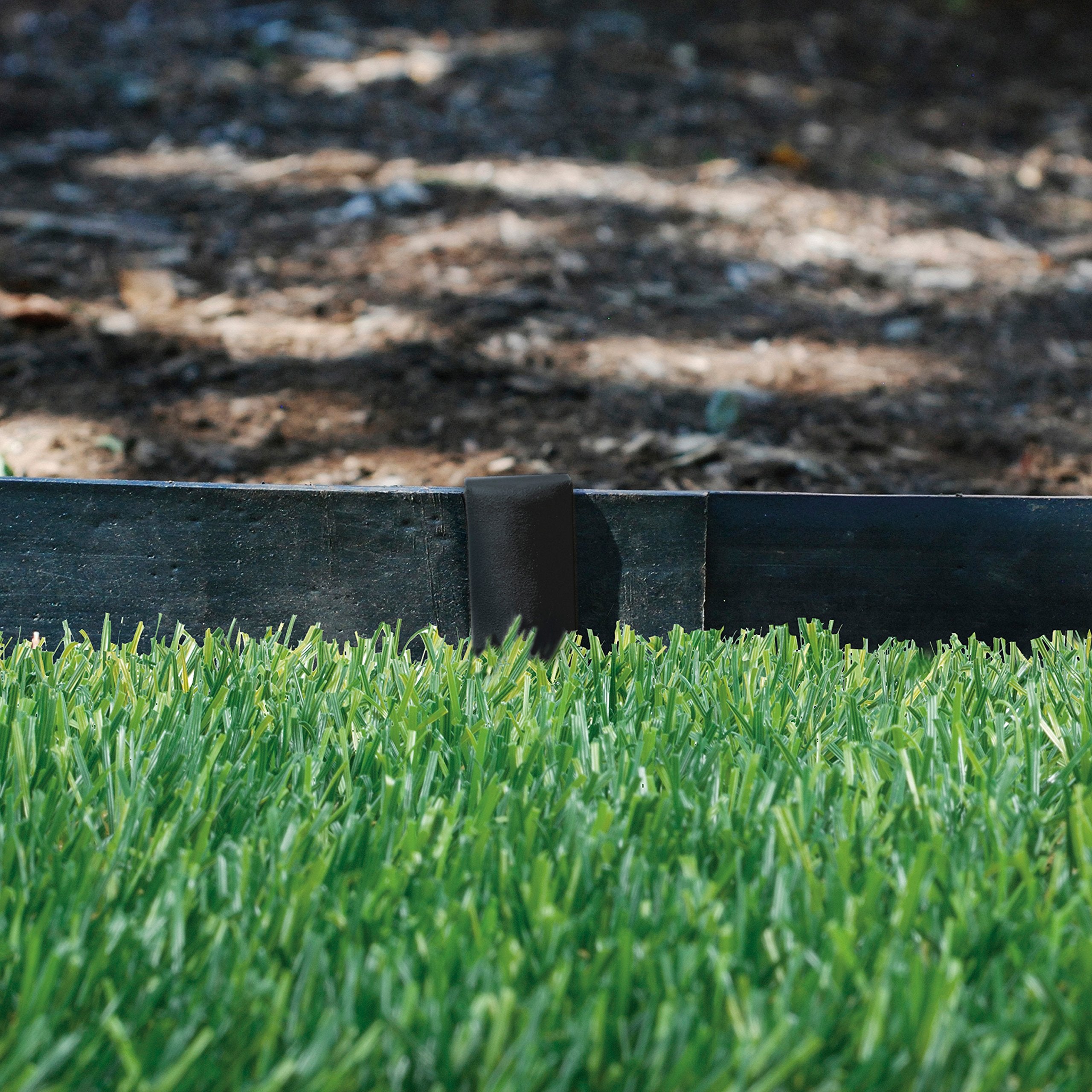 EasyFlex edging curves smoothly around plants for defined garden shapes.