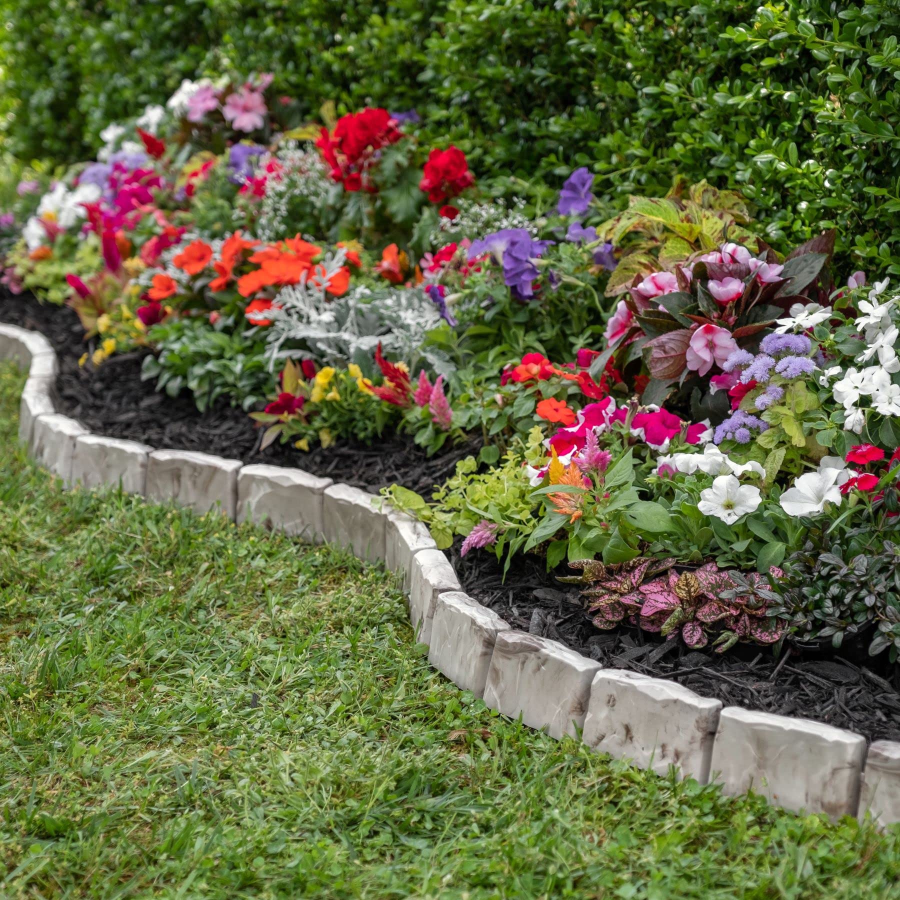 EasyFlex edging atop landscape fabric reduces weed growth where borders meet.